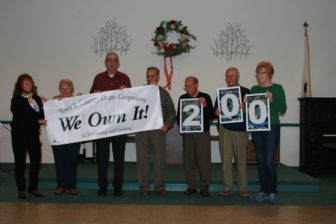 Photo of ROC leaders holding a We Own It banner