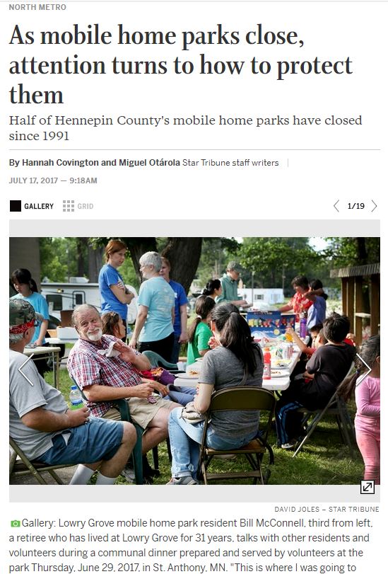 Screen shot of article with accompanying photo showing people forced to leave their community having a celebration in the weeks before the community closed.