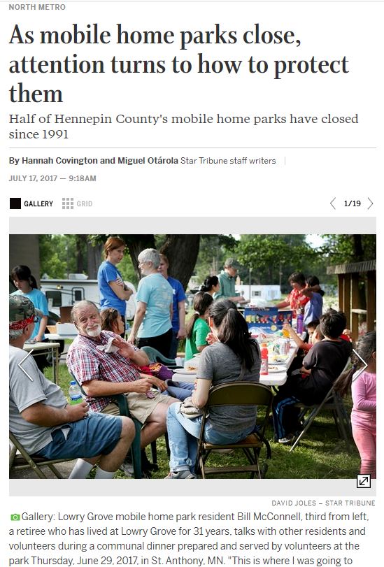 Screen shot of article with accompanying photo showing people forced to leave their community having a celebration in the weeks before the community closed.