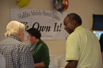 Photo pf residents at the Halifax Estates purchase celebration.